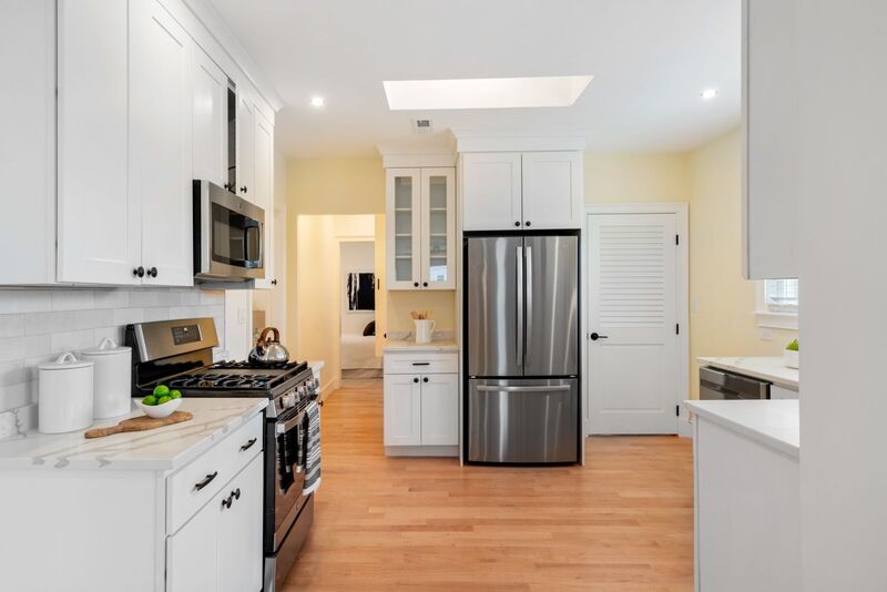 Kitchen at 84 Columbia Street Unit 3 Showing stainless stove and refrigerator